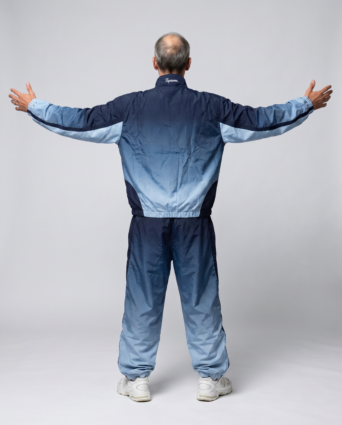 Supreme Umbro navy tracksuit on model back, AI styling preview